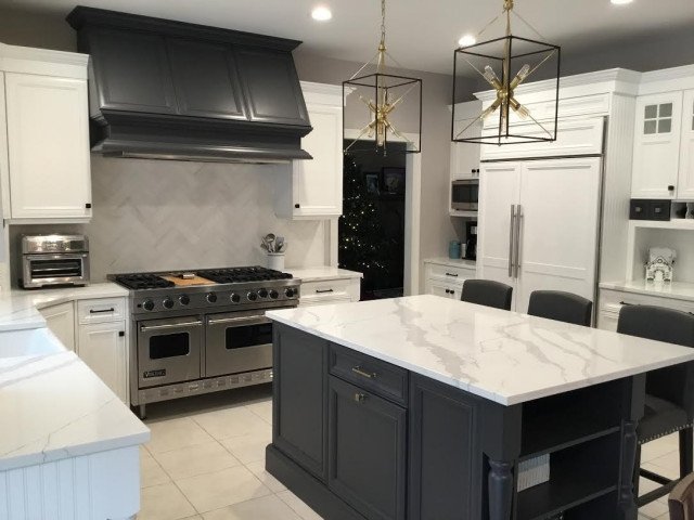 A Transitional Kitchen with a Gorgeous Herringbone Marble Backsplash